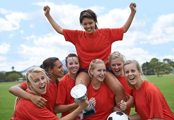 Young women soccer players with menstrual cups